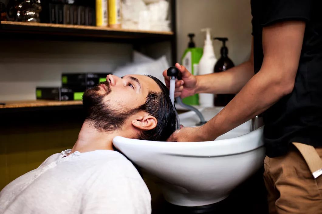 customer-getting-wash-after-haircut_23-2148256876